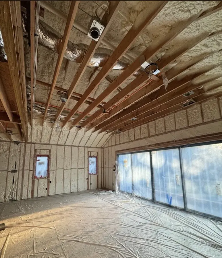 Interior walls and ceiling insulated with spray foam during new construction in Applewood